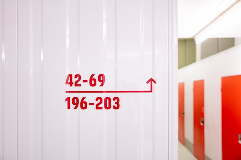 The image shows a room number sign indicating the room numbers 42-69 and 196-203, with an upward arrow symbol. The room appears to be part of a larger building or facility.