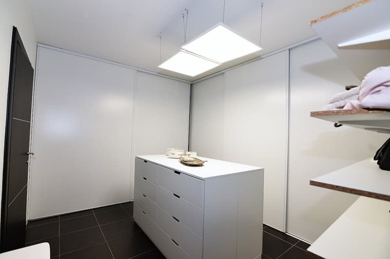 white walls, white floor, white wardrobe, white shelf, white cabinet, white ceiling lights