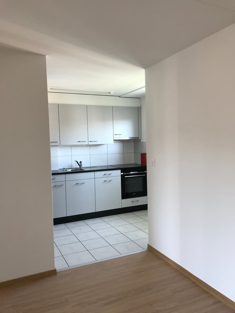 kitchen with white cabinets, black countertops, white tiles, sink, oven, dishwasher, washing machine