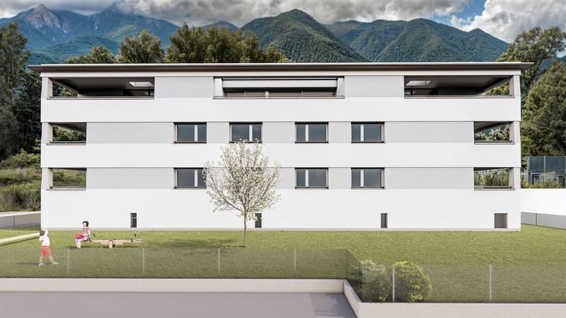 Modern building with a white exterior, multiple windows, and a green lawn in front. Two children are playing on a bench in the lawn.