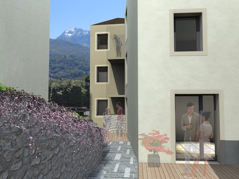 multi-storey residential building, white exterior, balcony on second floor, garden area with pink plants, wooden deck, mountain view