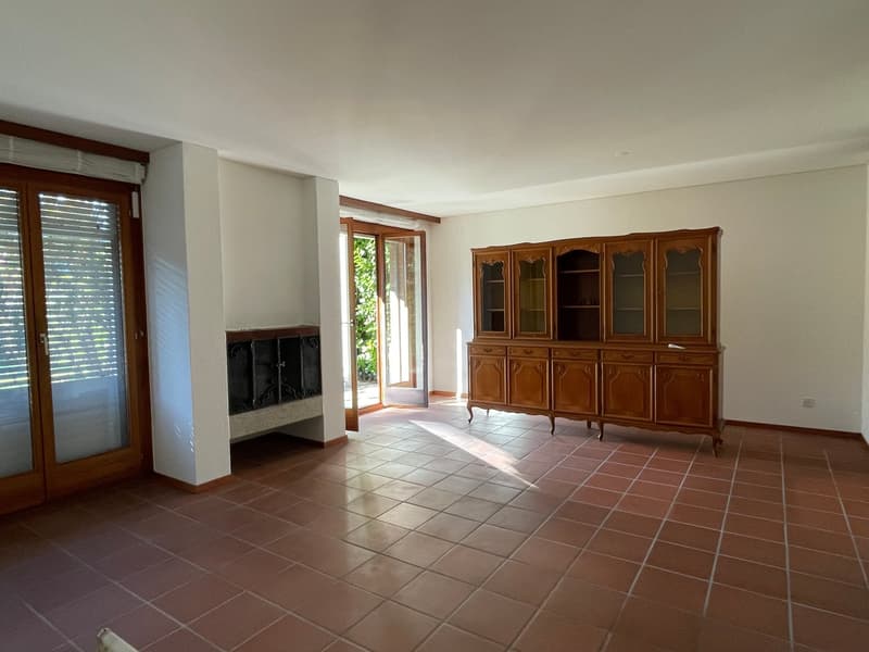 Fireplace, wooden cabinet, tiled floor, sliding doors, fireplace wall