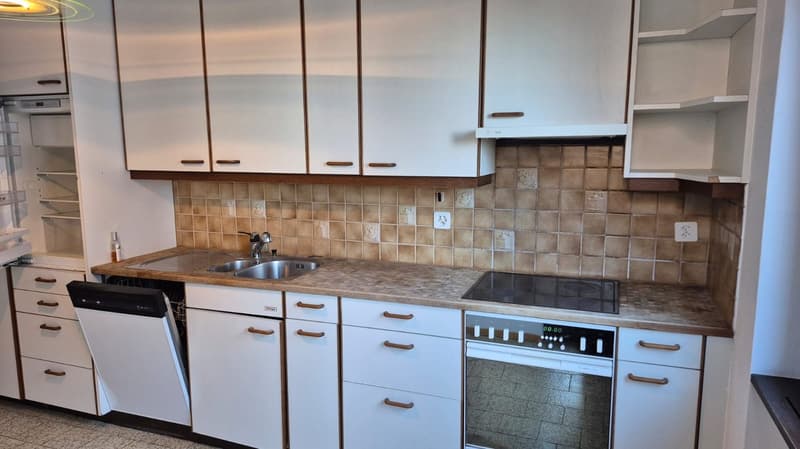 white cabinets, tiled backsplash, countertop with sink, oven, dishwasher, tiled floor