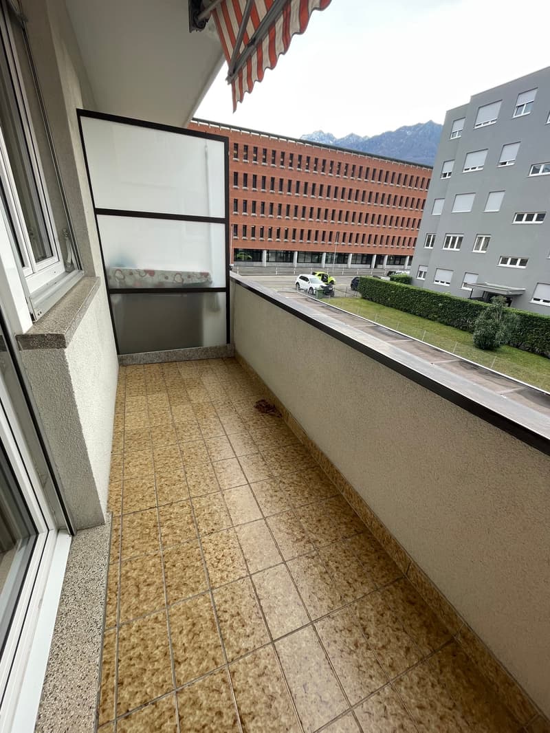 tiled floor, glass wall, open balcony, view of road and mountains