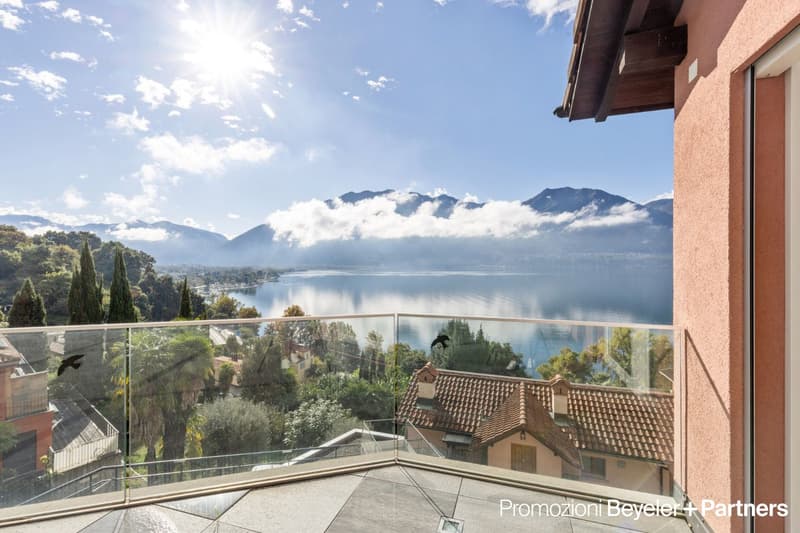 glass railings, balcony with panoramic view, lake, mountains