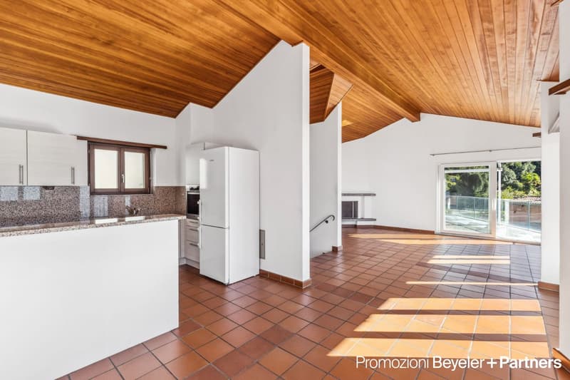 modern kitchen with white cabinets, granite countertop, white fridge, tiled floor, wooden ceiling