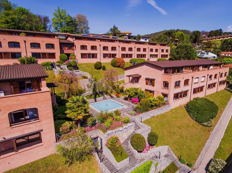 Collection of buildings with swimming pool and landscaped garden