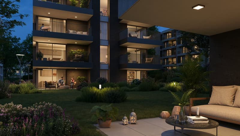 3 story apartment building with balconies, exterior seating area with tables and plants, outdoor garden, and evening lighting