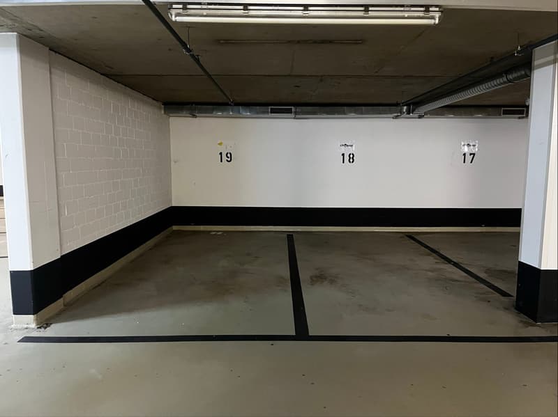 Underground parking space with labeled parking spots 17, 18, and 19.