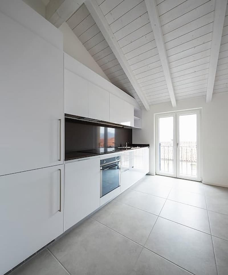 modern kitchen, white cabinets, tiled floor, stainless steel appliances, large windows