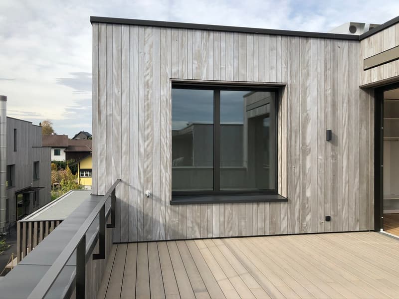 wooden exterior, large window, balcony, wooden deck