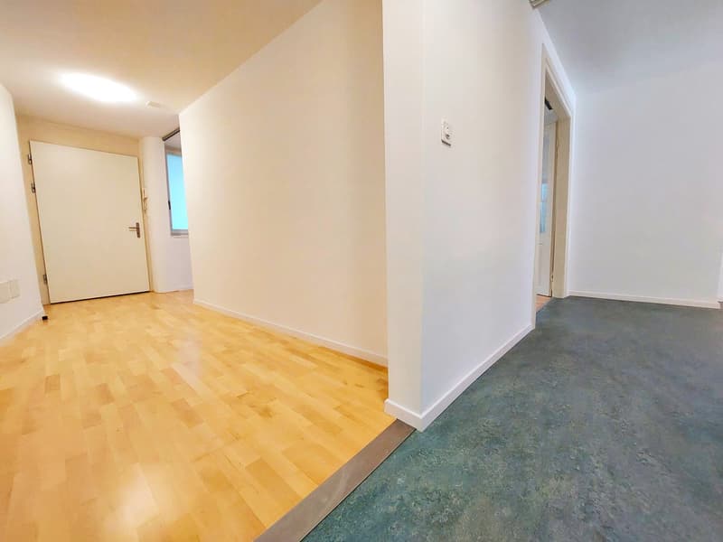 empty room, wooden floor, white walls, open door