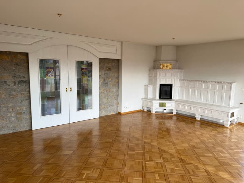 wooden parquet floor, white walls, fireplace, double doors, stone wall