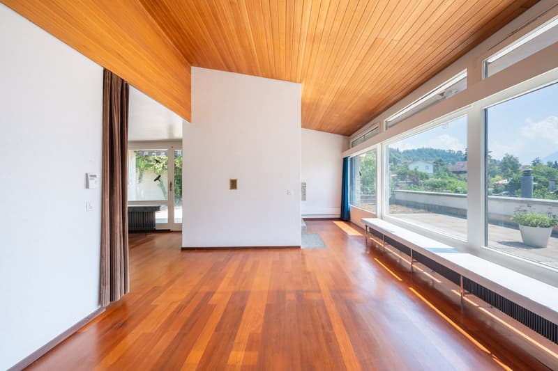wooden floor, white walls, large windows, wooden ceiling, bench, radiator