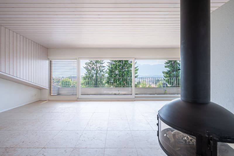 empty room, white tiled floor, white walls, fireplace, large windows, balcony