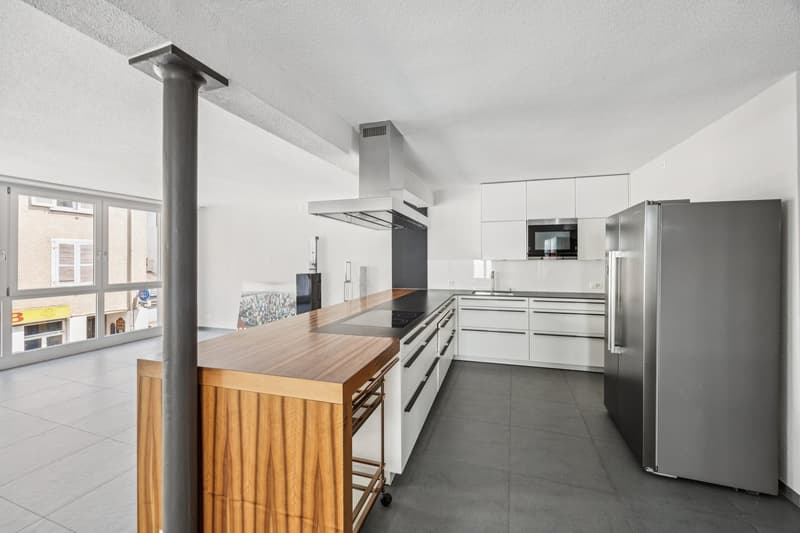 modern white kitchen, wooden kitchen island, large windows, stainless steel refrigerator