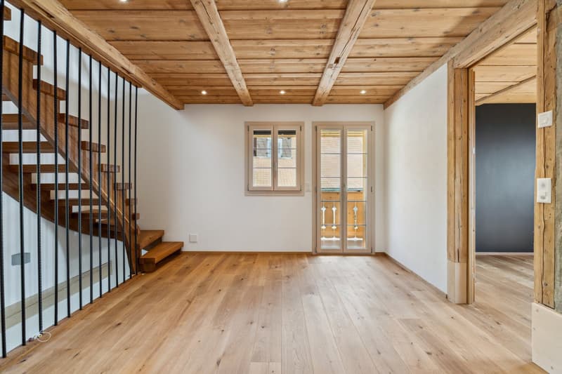 Exposed wooden ceiling, wooden staircase, wooden flooring, glass doors