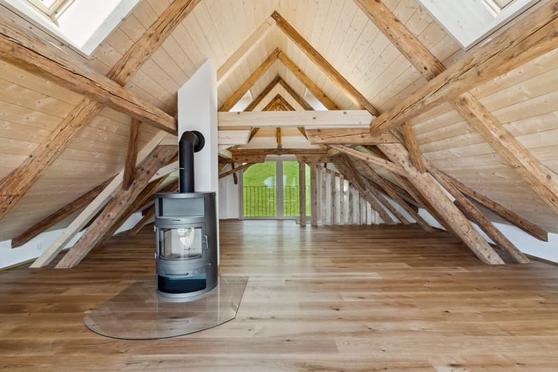 wooden attic, fireplace, wooden floors, wooden ceiling beams