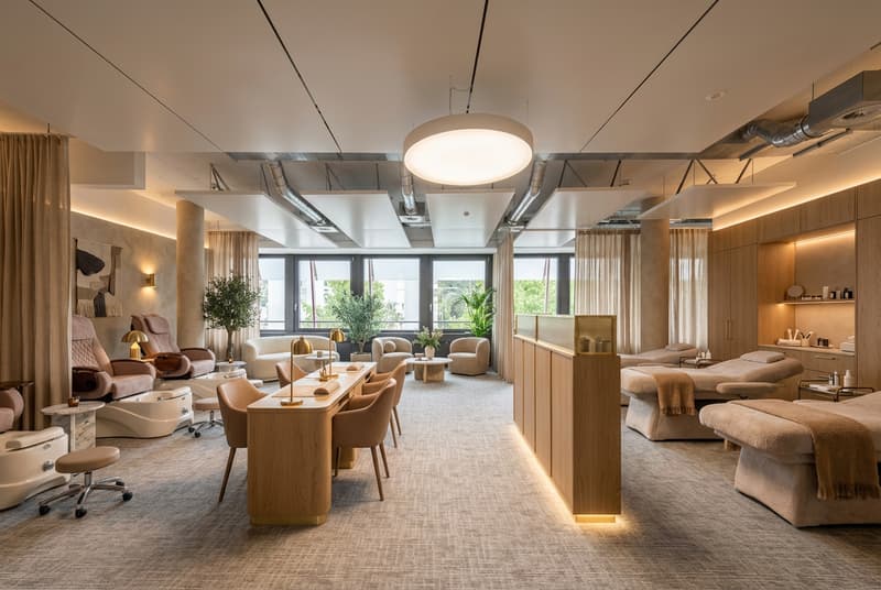 Lighting from ceiling and wall, couches, massage tables, tables, chairs, plants