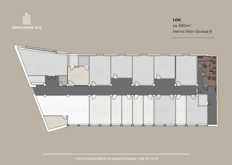 Floor plan of a building with multiple rooms and a central corridor