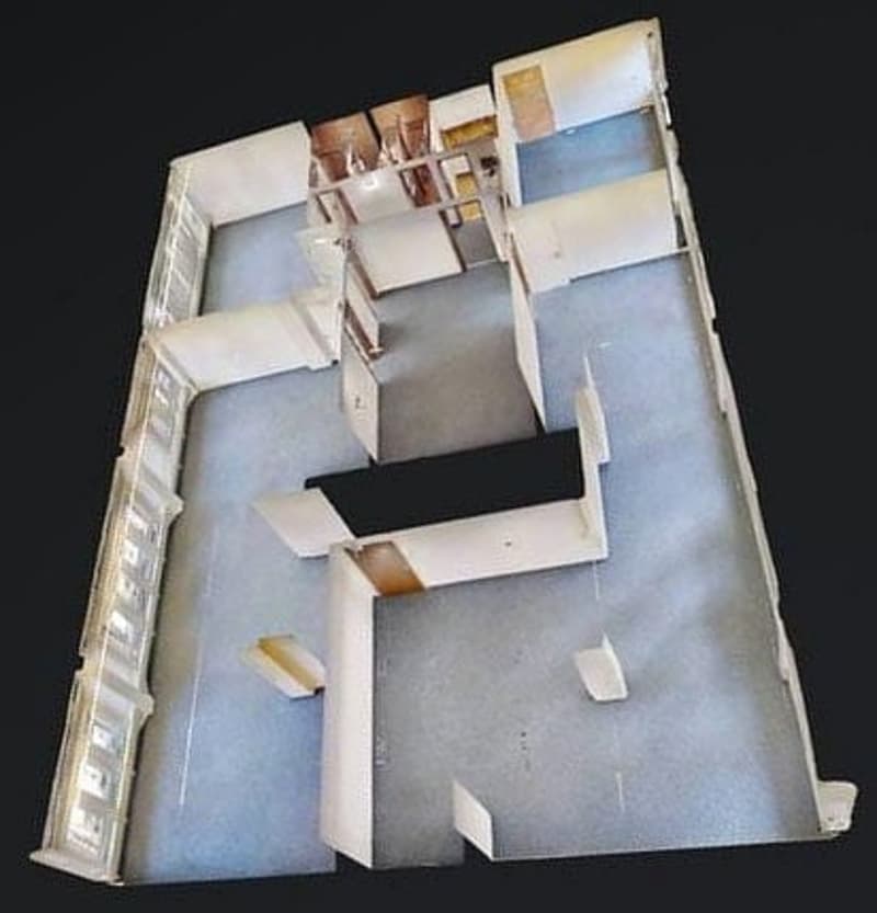 Multiple sections, rooms labeled, central corridor