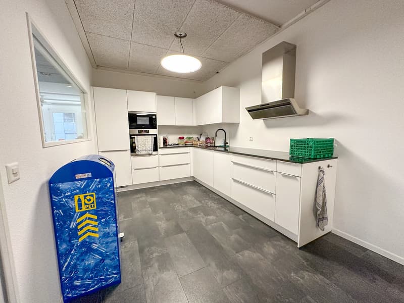 modern kitchen, white cabinets, granite countertops, gas stove, microwave, dishwasher, round ceiling light, glass window
