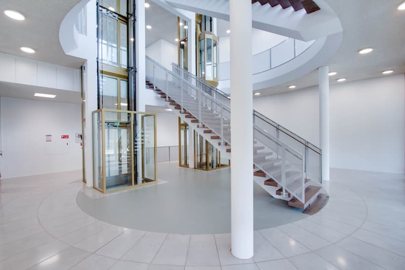 Modern design, elevator, spiral staircase, wide open spaces, tiled floor