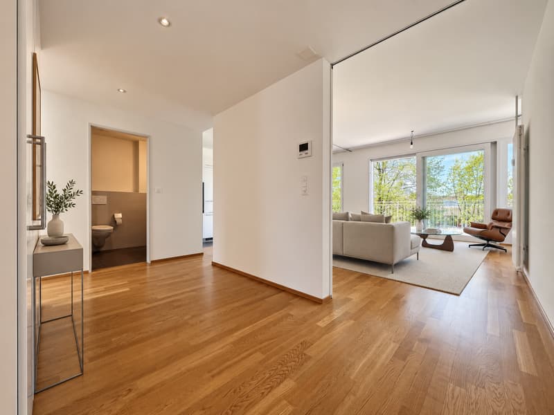 Korridor / Eingang (Die abgebildeten Möbel wurden mithilfe von KI ergänzt und dienen ausschliesslich der Veranschaulichung der Räume; die Wohnung wird unmöbliert vermietet)