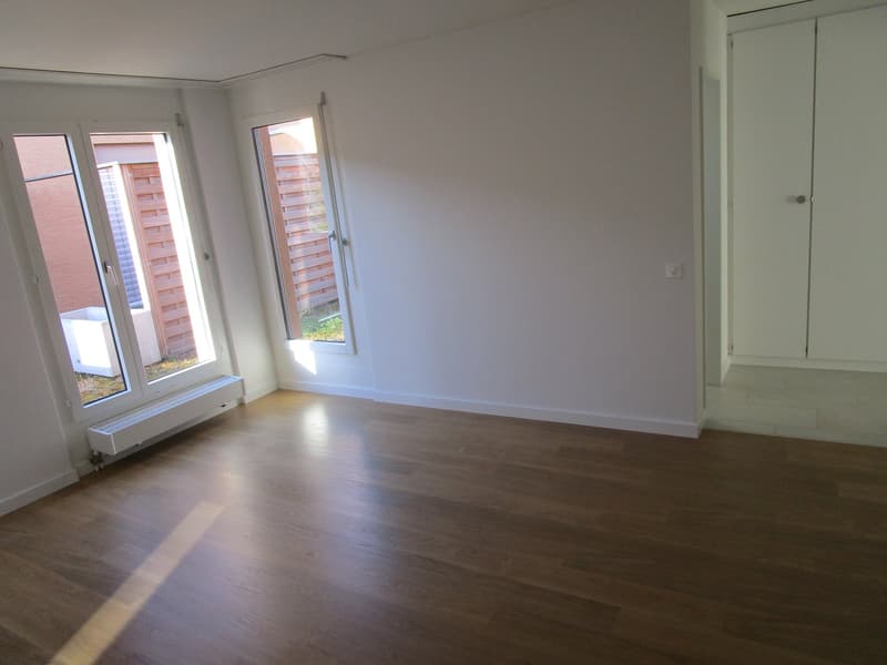 empty room, wooden floor, white walls, two glass doors with double glass, small window, built-in heater