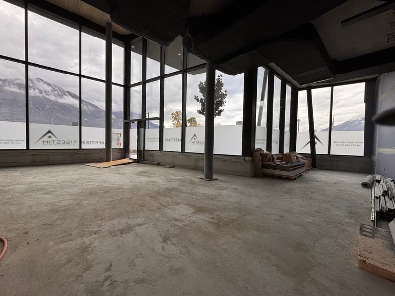 empty room, concrete floor, glass windows, construction materials