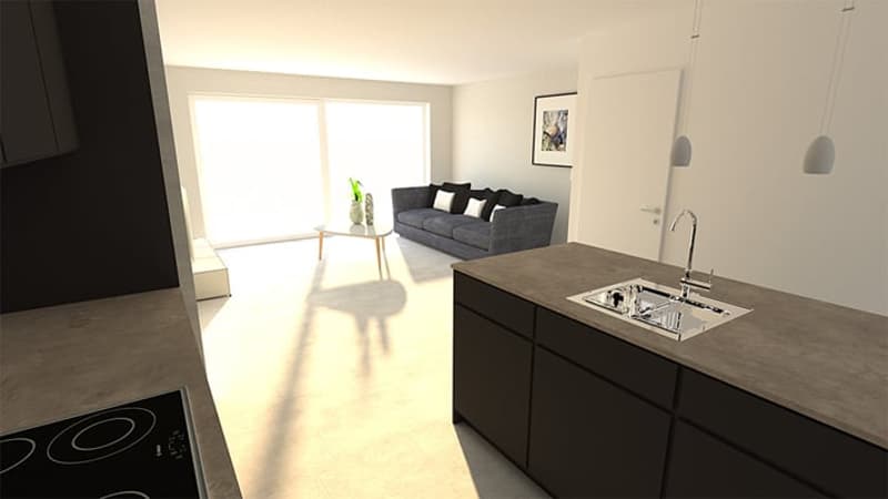 Open-concept living room and kitchen, with large windows, grey sofa, and modern kitchen countertops and appliances