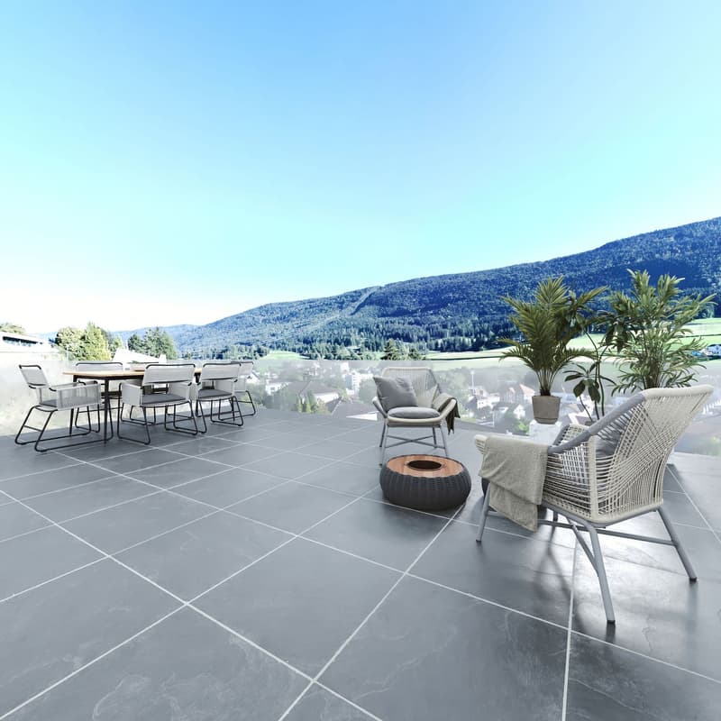 terraced floor, table with chairs, plants, mountain view