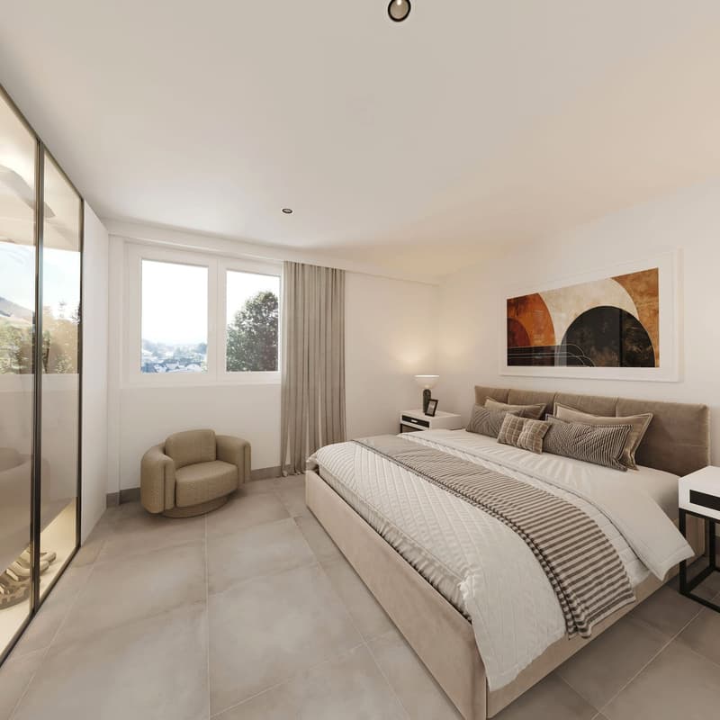 King size bed, multiple pillows, 2 bedside tables, lamps, painting on the wall, a chair and glass walls
