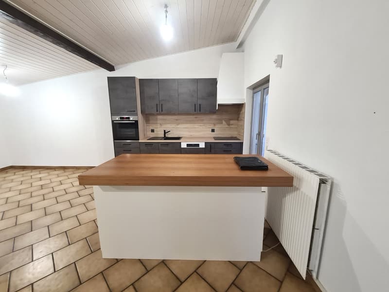 modern kitchen, grey cabinets, wooden island, ceramic floor, white radiator, electric oven