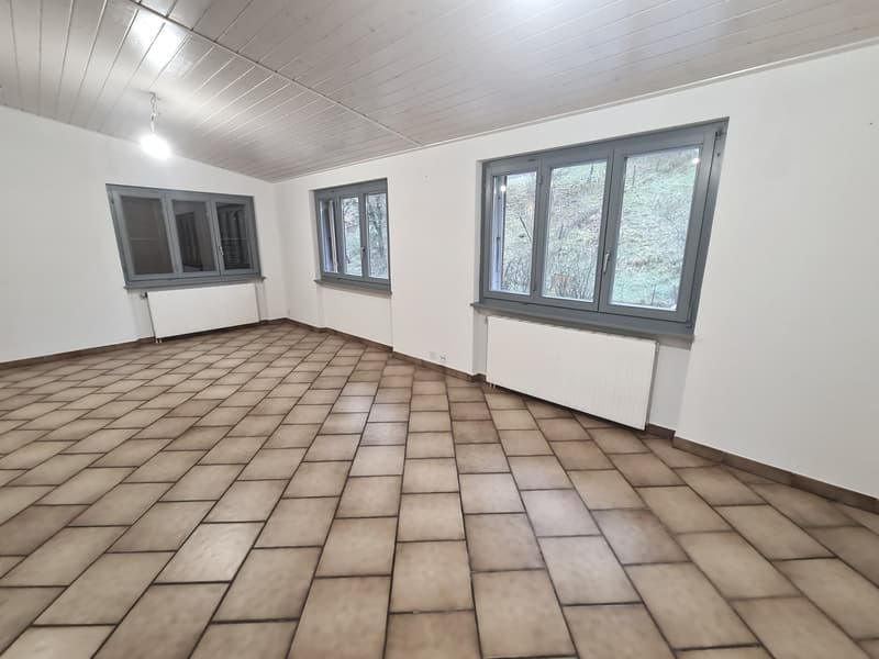 empty room with tiled floor, white walls, white ceiling, three windows, two radiators