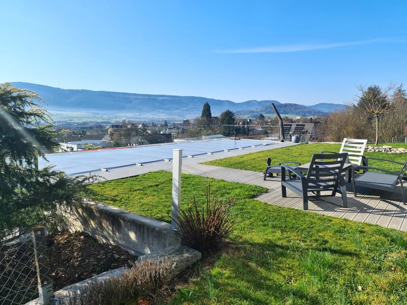 terrace with table and chairs, greenery, fenced area, panoramic view