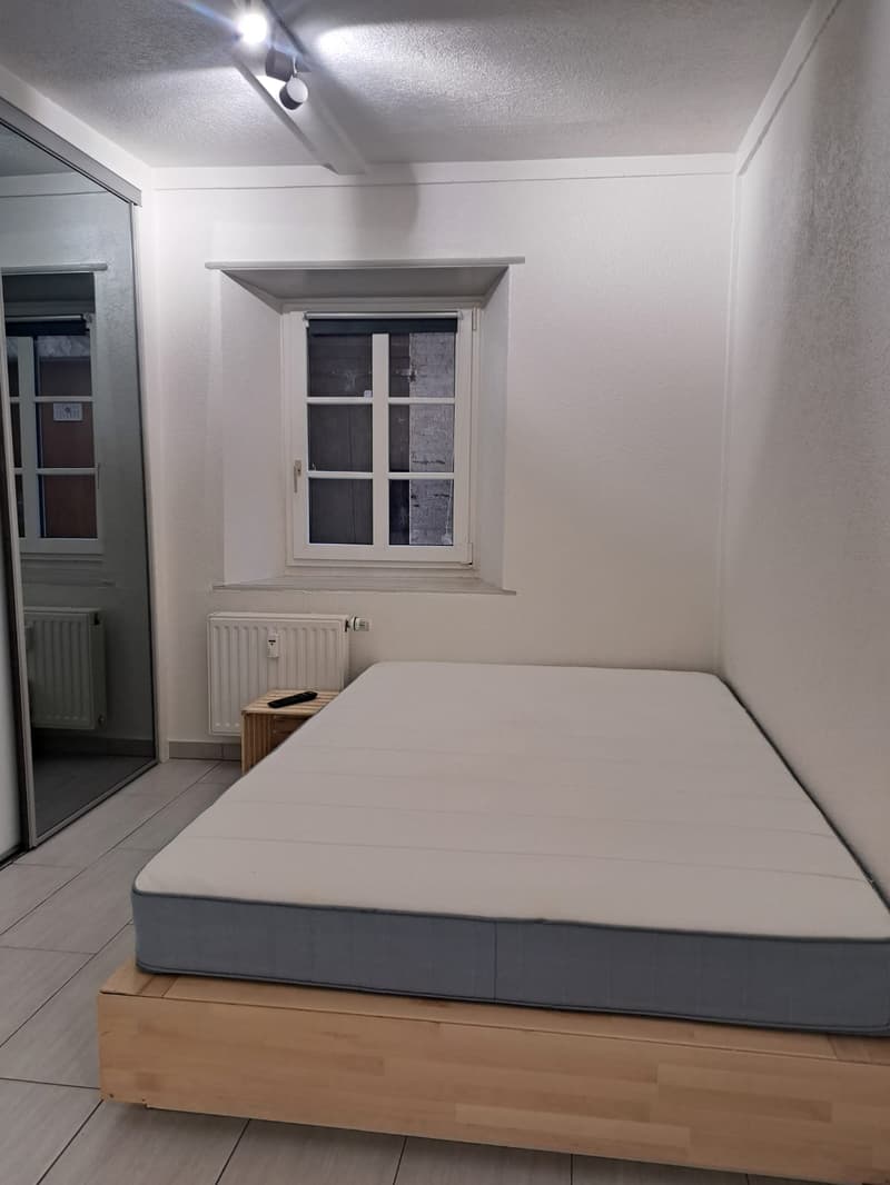 single bed, window, radiator, wooden floor, nightstand
