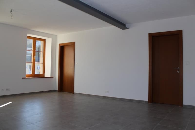 empty room, white walls, wooden doors, window, tiled floor, power outlets