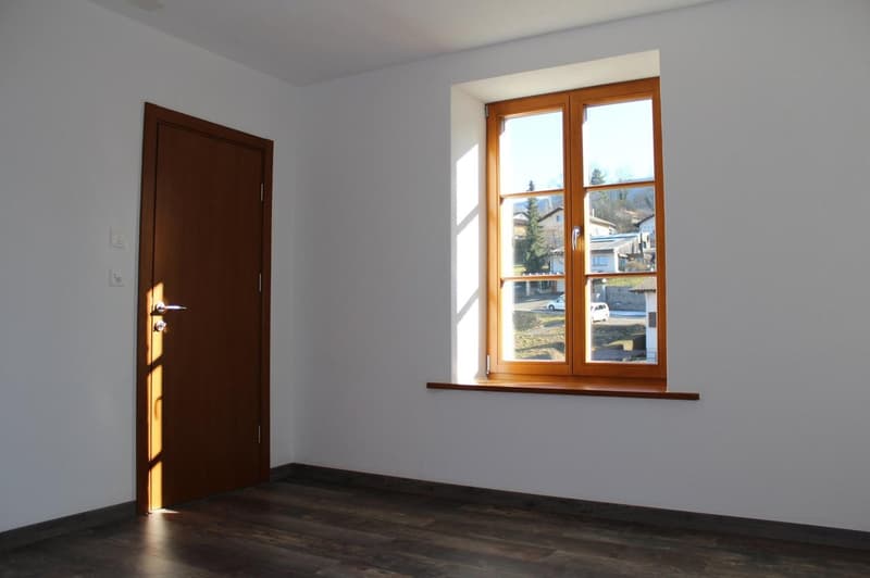 empty room, wooden door, wooden window, white walls, wooden floor