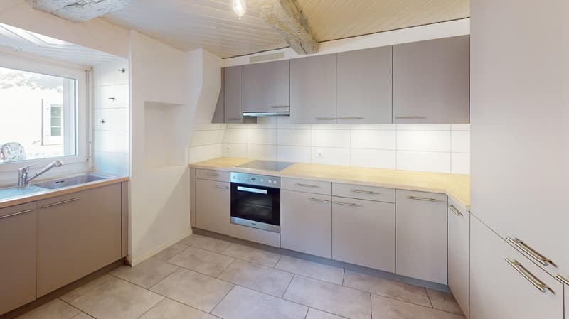 modern kitchen, white cabinets, wooden countertop, built-in oven and dishwasher, large sink, stainless steel faucet