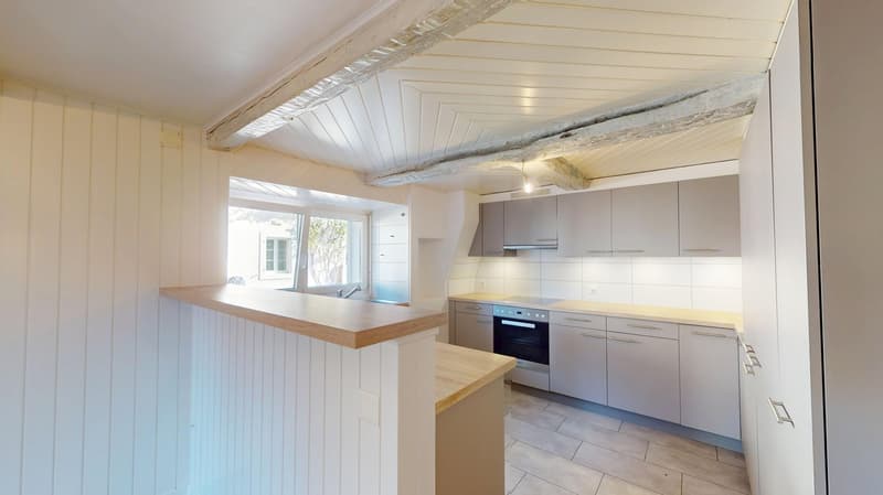 kitchen: wooden counters, white cabinets, tile floor, modern appliances