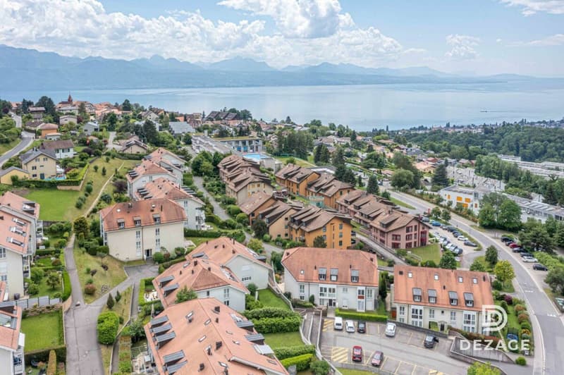 Vaste attique baigné de lumière dans un quartier familial avec vue panoramique sur le Lac (12)