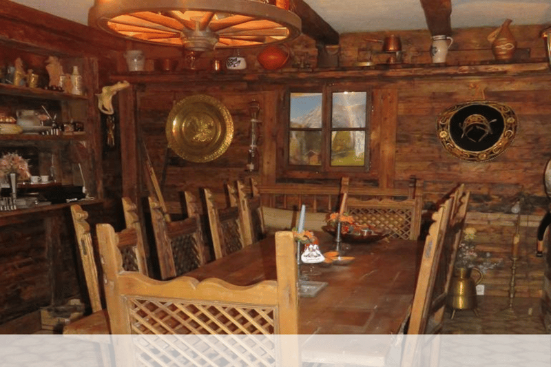 wooden chairs, wooden table, wooden wall, chandelier