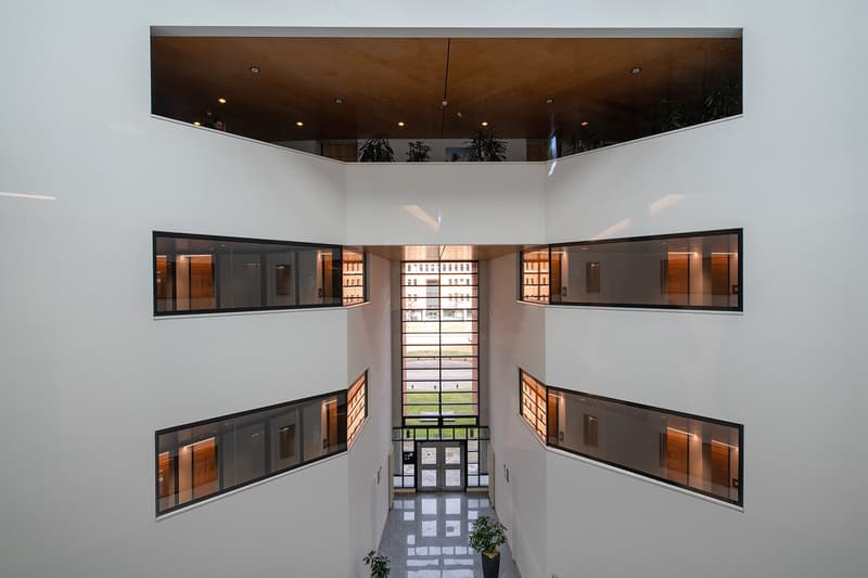 atrium, modern design, glass walls, view of the outside, greenery, clean and spacious