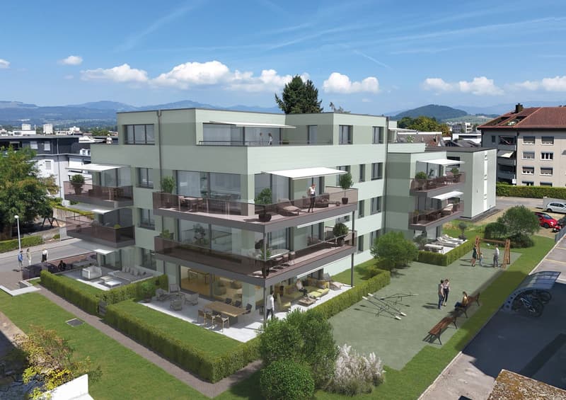 Three story building, multiple balconies, garden, parking, playground