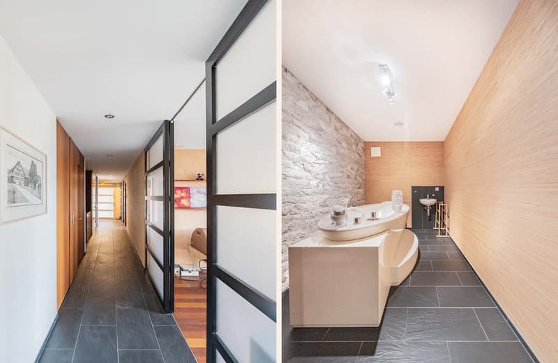 modern bathroom with large soaking tub and white tiled floor, small sink