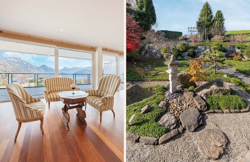 interior with wooden floor, glass wall, balcony with mountains view, 2 chairs, round table; garden with gravel path, rocks, plants, lantern, grassy area