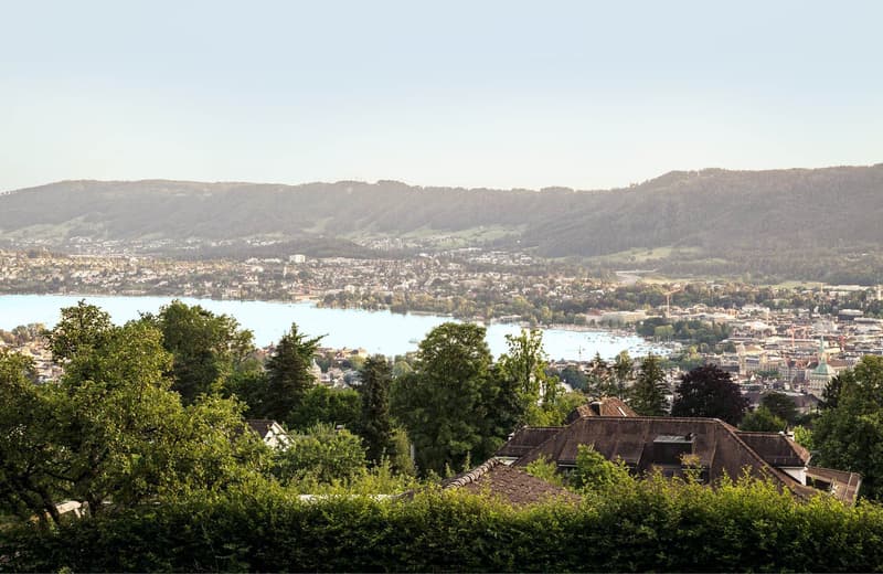 Overlooking a town with a lake in the background
