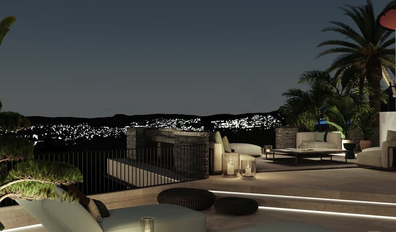 Stone terrace with illuminated lamps, white couches, central table, and green trees. The terrace overlooks the city of Los Angeles
