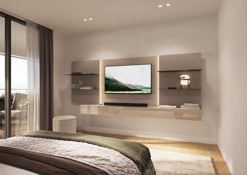 bedroom with bed, TV, shelves, ottoman, rug, large windows